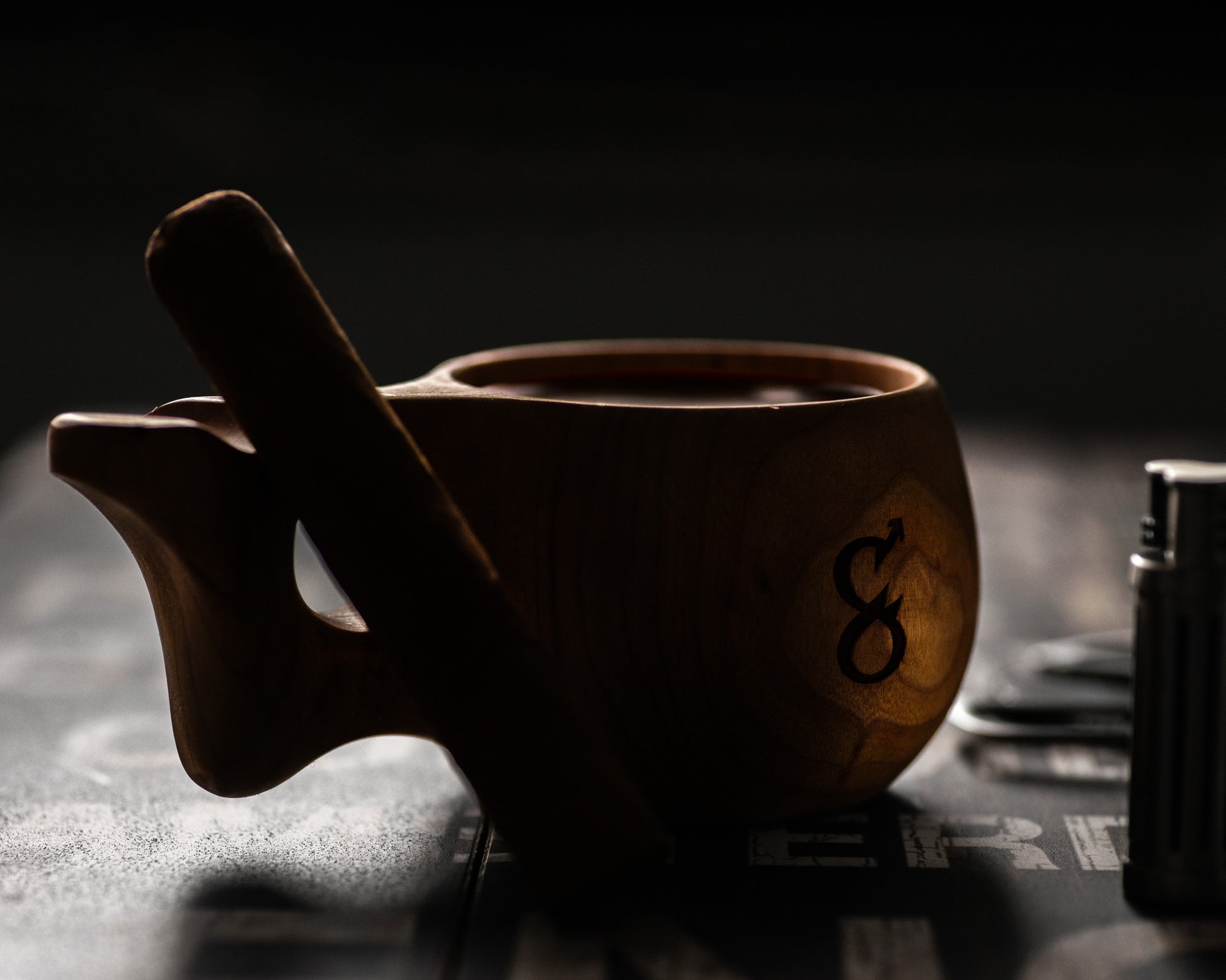 Dark artsy picture of hand crafted wooden mug