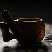 Dark artsy picture of hand crafted wooden mug