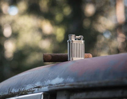 Sisuman Soft Flame Lighter on rusty car